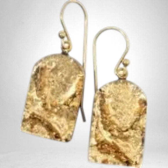 Gold rectangular drop earrings with a textured marbled finisg and short hooks