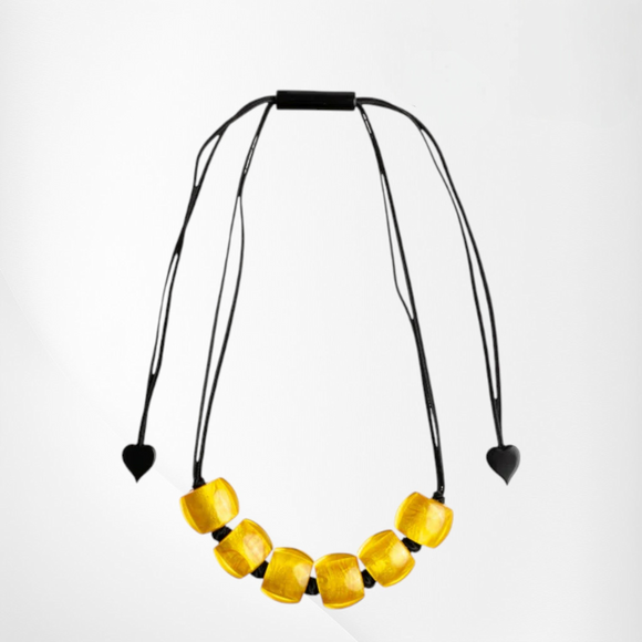 Style and Grace BELLISSIMA GYEL adjustable necklace with yellow glass beads on a black cord with heart-shaped ends.