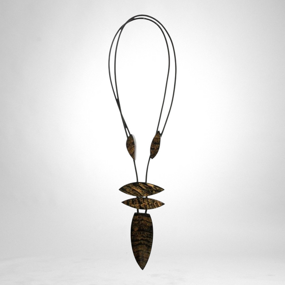 Style and Grace JUNO adjustable pendant necklace featuring five black and gold textured beads on a cord