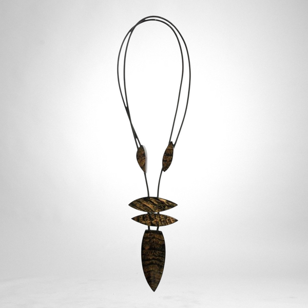 Style and Grace JUNO adjustable pendant necklace featuring five black and gold textured beads on a cord
