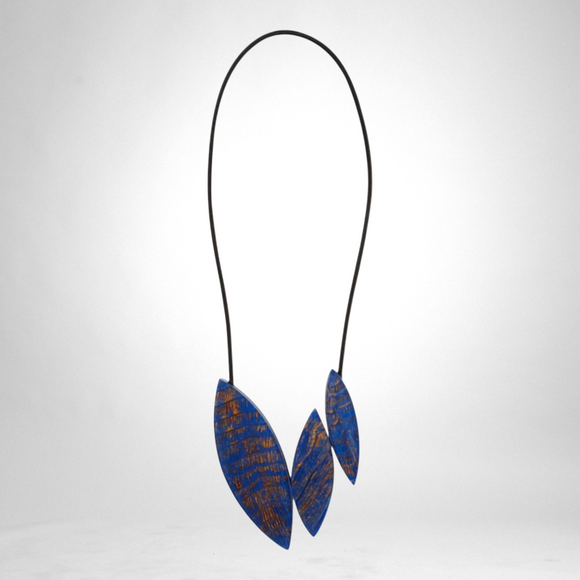 Style and Grace JUNO blue necklace featuring three leaf-shaped pendants with textured blue and copper detailing