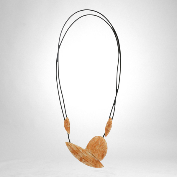 Style and Grace Juno cream necklace featuring a unique abstract wooden pendant on a double black cord