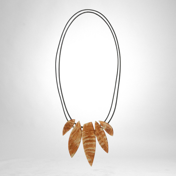 Style and Grace JUNO cream necklace featuring a unique leaf-shaped wooden pendant on a double black cord