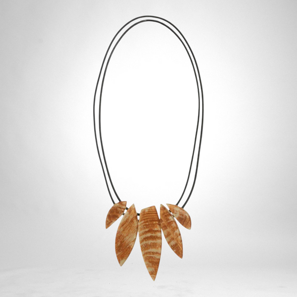 Style and Grace JUNO cream necklace featuring a unique leaf-shaped wooden pendant on a double black cord