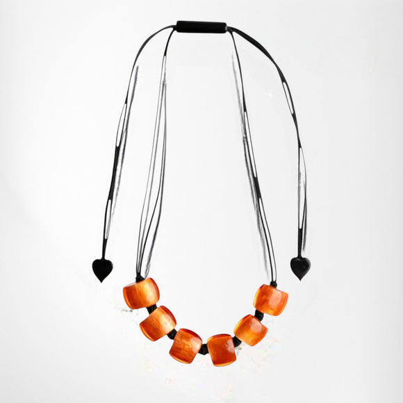 Style and Grace BELLISSIMA GRED adjustable necklace featuring orange square resin beads on a black cord