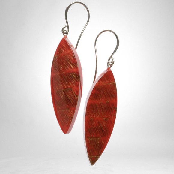 Style and Grace JUNO red drop earrings featuring a marquise-shaped bead with gold-toned textured accents on silver hooks