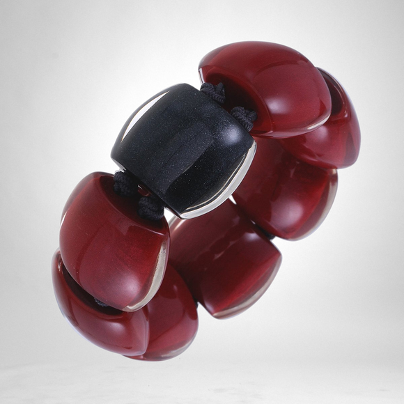 Style and Grace Bellissima 301 bracelet featuring chunky red resin beads and a central black bead on a cord